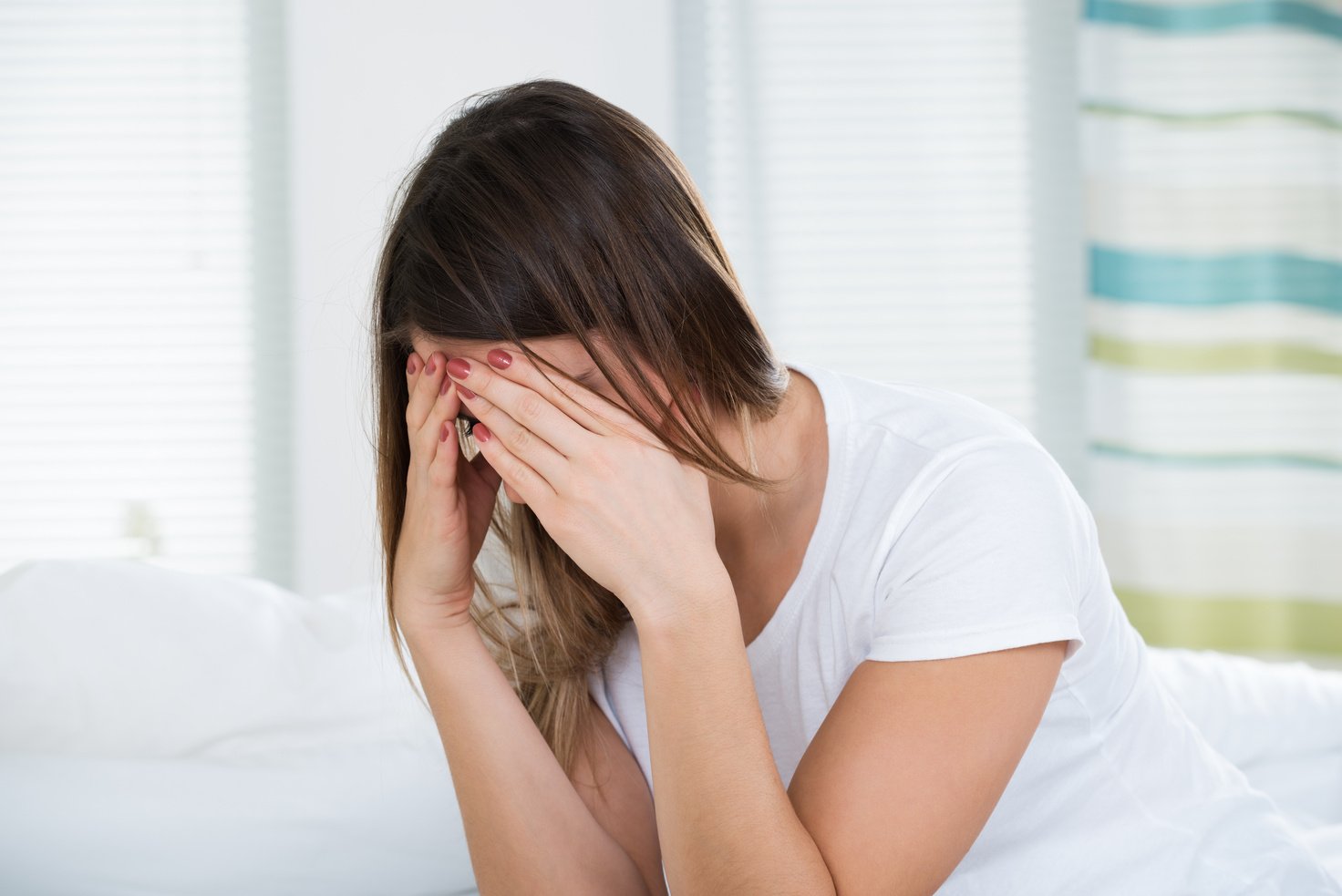 Woman With Headache Holding Head